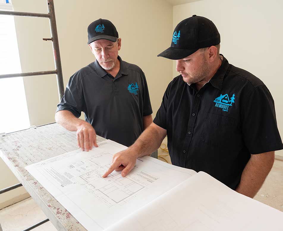 UHRE workers looking at blueprints